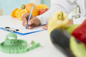 close-up-nutritionist-writing-prescription1